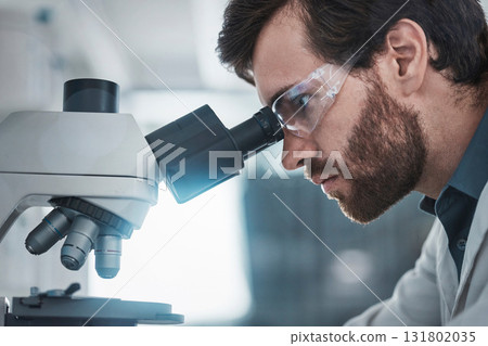 Biotechnology, microscope and focus of scientist checking research data from particles study. Chemistry lab, studying and man working on medical and healthcare innovation with health analytics Biotechnology, microscope and focus of scientist checking research data from particles study. Chemistry lab, studying and man working on medical and healthcare innovation with health analytics 131802035
