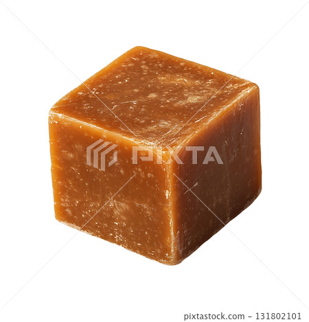 Brown sugar block cube, showing textured surface details, casting subtle shadow on transparent background 131802101