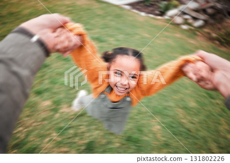 Blur, happy and a child and father swinging, playing and bonding in the garden. Smile, playful and a little girl moving with energy during playtime with dad holding hands to swing in the backyard Blur, happy and a child and father swinging, playing and bonding in the garden. Smile, playful and a little girl moving with energy during playtime with dad holding hands to swing in the backyard 131802226