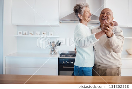 Love, retirement and dancing, old couple in kitchen at home, weekend time and celebrate romance with smile. Dance, happiness and bonding, happy man and senior woman having fun in house or apartment. Love, retirement and dancing, old couple in kitchen at home, weekend time and celebrate romance with smile. Dance, happiness and bonding, happy man and senior woman having fun in house or apartment. 131802318