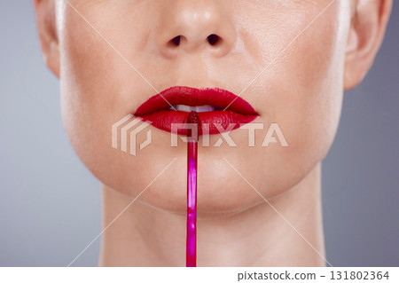 Red lipstick, lips and woman isolated on a studio background for makeup or product promotion. Model face with mouth closeup for cosmetics gloss, shine or color makeup stick with skincare and beauty 131802364