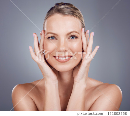 Skincare, woman and portrait in studio for beauty, dermatology and wellness cosmetics on background. Happy mature female model touch face for aesthetic glow, shine and healthy facial transformation Skincare, woman and portrait in studio for beauty, dermatology and wellness cosmetics on background. Happy mature female model touch face for aesthetic glow, shine and healthy facial transformation 131802368