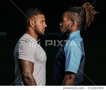 Profile, rival and a sports black man facing his opponent while looking serious in studio on a dark background. Face, challenge or conflict with a male athlete and competitor ready for competition 131802408