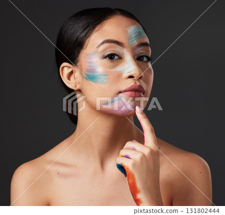 Skin, art and portrait of woman with face paint, creative makeup and self expression. Beauty, creativity and color in artistic cosmetics, empowerment and freedom to express for young beautiful girl. 131802444