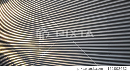 Corrugated Metal Wall Texture with Dynamic Shadows and Highlights 131802682