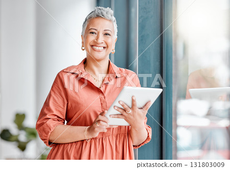 Tablet, portrait and senior business woman in office, research or internet browsing. Technology, smile or happy female ceo with touchscreen by window for networking, social media or web scrolling Tablet, portrait and senior business woman in office, research or internet browsing. Technology, smile or happy female ceo with touchscreen by window for networking, social media or web scrolling 131803009