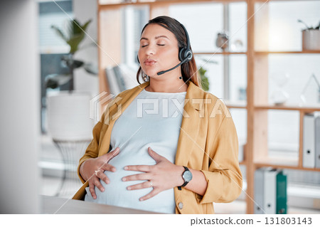 Office, stress and pregnancy, breathing exercise and woman at desk with hand on stomach in call center with headset. Breathe, pain and pregnant telemarketing consultant relax holding belly with hands 131803143