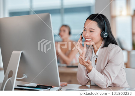 Asian woman, call center and computer with smile for telemarketing, customer support or service at office desk. Happy female consultant agent smiling in contact us for desktop advice, help or sales Asian woman, call center and computer with smile for telemarketing, customer support or service at office desk. Happy female consultant agent smiling in contact us for desktop advice, help or sales 131803223