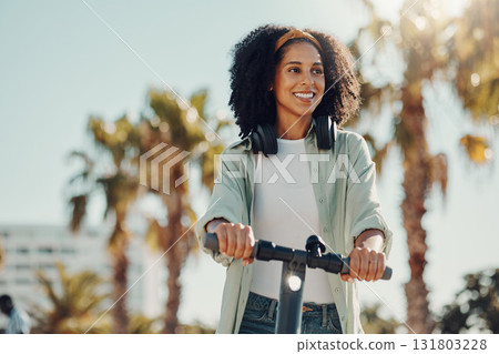 black woman, scooter or ebike for city travel while thinking about idea for eco friendly lifestyle. Happy model person on future electric bike for environment and carbon footprint on road in Miami 131803228