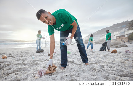 Volunteer portrait, beach cleaning or man for recycling plastic bottle for community service, pollution and earth day. Smile, ngo team or sand trash for climate change, nature and helping environment Volunteer portrait, beach cleaning or man for recycling plastic bottle for community service, pollution and earth day. Smile, ngo team or sand trash for climate change, nature and helping environment 131803230