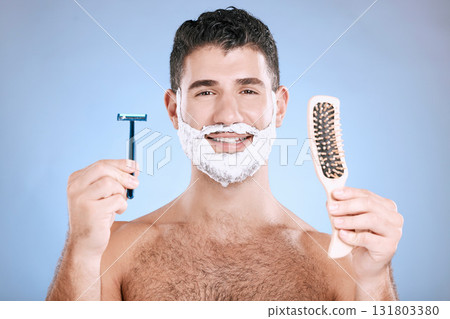 Portrait, man and brush with razor, cream and mockup with guy, hygiene and grooming on blue studio background. Face, male or gentleman with skincare, cosmetic equipment or hair removal for confidence Portrait, man and brush with razor, cream and mockup with guy, hygiene and grooming on blue studio background. Face, male or gentleman with skincare, cosmetic equipment or hair removal for confidence 131803380