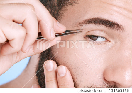 Tweezers, beauty and hair removal with eyebrow of man for grooming, skincare and maintenance. Hygiene, cosmetics and self care with closeup of model shaping growth for treatment, clan and facial 131803386