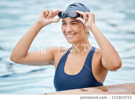 Swimming pool, sports and face of woman swimmer ready for training, water polo game and exercise in gym. Fitness, wellness and happy female athlete smile for competition, workout and race challenge Swimming pool, sports and face of woman swimmer ready for training, water polo game and exercise in gym. Fitness, wellness and happy female athlete smile for competition, workout and race challenge 131803552