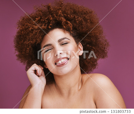 Tongue, portrait or afro hairstyle on isolated purple background in happy emoji, goofy or silly facial expression. Woman beauty, funny face or natural hair growth on studio backdrop in skincare salon Tongue, portrait or afro hairstyle on isolated purple background in happy emoji, goofy or silly facial expression. Woman beauty, funny face or natural hair growth on studio backdrop in skincare salon 131803733