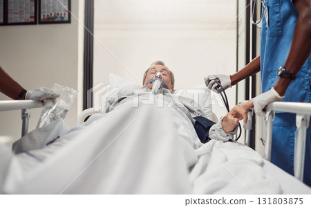 Hospital, senior patient and doctors for emergency on a bed with oxygen mask for healthcare. Sick old man with health problem and medical team er or surgery in theater for life insurance and help 131803875