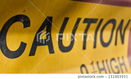 Bright yellow caution sign alerts to danger Bright yellow caution sign alerts to danger 131803931