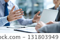 Close-up of male businessman's hands discussing business strategy in a conference room 131803949