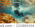 Professional diving, scuba diver in the depths of water with cylinders among colorful fish, corals and stones. 131804104
