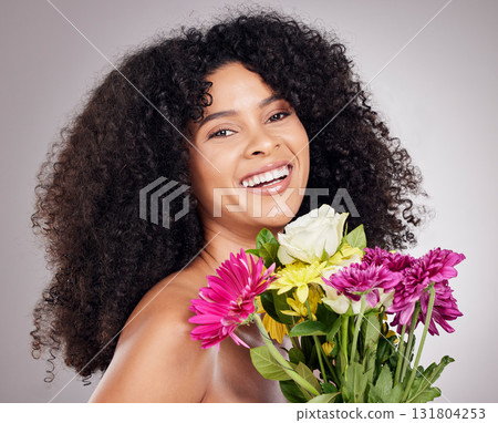 Skincare, portrait of black woman or sunflower in hair in studio for spring, luxury spa or sustainable. Aesthetic, beauty facial or girl face with plants for natural afro, cosmetics or eco friendly 131804253