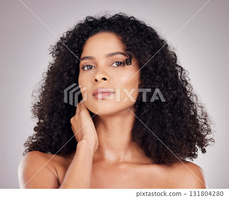 Hair, beauty and portrait of black woman for natural wellness, growth and shine on gray background. Salon aesthetic, face and serious girl with keratin treatment, curly hairstyle and luxury cosmetics Hair, beauty and portrait of black woman for natural wellness, growth and shine on gray background. Salon aesthetic, face and serious girl with keratin treatment, curly hairstyle and luxury cosmetics 131804280