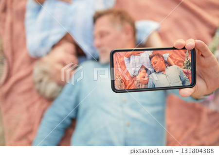 Relax, love and selfie with phone screen and old couple on picnic for bonding, anniversary and celebration. Happy, technology and picture with senior man and woman for health, social media and summer Relax, love and selfie with phone screen and old couple on picnic for bonding, anniversary and celebration. Happy, technology and picture with senior man and woman for health, social media and summer 131804388