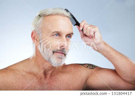 Old man, comb hair and grooming, beauty and haircare with hygiene and skin isolated on studio background. Senior male, cosmetics and brushing with cosmetology, routine and hairstyle with self care 131804417
