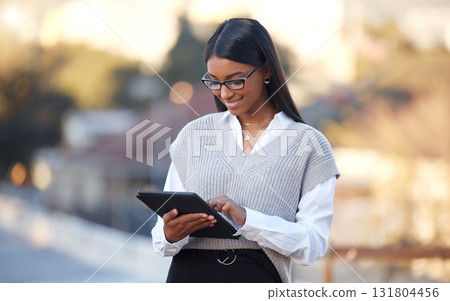 Woman, tablet and typing in street with smile for texting, social media or chat app at job for digital newspaper. Journalist, content creator and mobile touchscreen for notes, news and idea for story 131804456