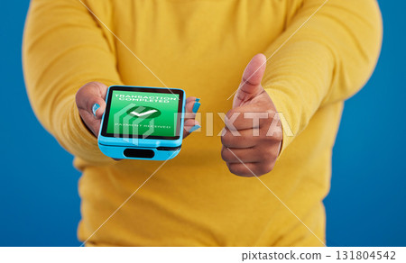 Phone screen, transaction and person thumbs up for payment success in e commerce, online shopping and mobile app. Yes, like and thank you sign of woman with machine and fintech check mark in studio Phone screen, transaction and person thumbs up for payment success in e commerce, online shopping and mobile app. Yes, like and thank you sign of woman with machine and fintech check mark in studio 131804542