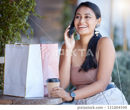 Woman with shopping bag, phone call and relax at coffee shop after retail therapy, fashion and rest. Female outdoor, latte drink and communication with chat, smile and happy with discount and sale 131804599
