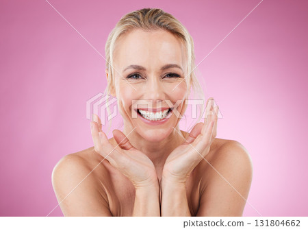 Beauty, portrait of woman with smile and hands up, glowing skin with natural spa makeup in studio. Mockup, advertising and skincare, luxury cosmetics, face of happy model isolated on pink background. Beauty, portrait of woman with smile and hands up, glowing skin with natural spa makeup in studio. Mockup, advertising and skincare, luxury cosmetics, face of happy model isolated on pink background. 131804662
