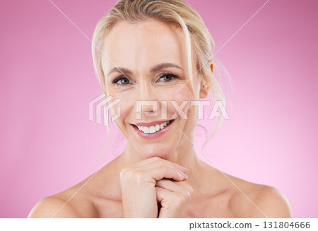 Skincare, makeup and portrait of woman with smile, glowing skin and natural beauty in studio. Mockup, advertising and beauty, luxury cosmetics, face of happy blonde model isolated on pink background. Skincare, makeup and portrait of woman with smile, glowing skin and natural beauty in studio. Mockup, advertising and beauty, luxury cosmetics, face of happy blonde model isolated on pink background. 131804666