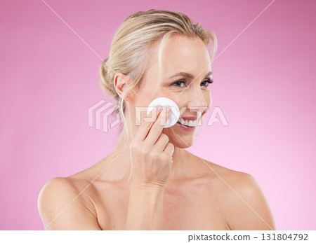Beauty, skincare and woman with cotton in studio for cosmetics, makeup and dermatology. Happy aesthetic model person on pink background for luxury facial detox and cleaning face with natural product Beauty, skincare and woman with cotton in studio for cosmetics, makeup and dermatology. Happy aesthetic model person on pink background for luxury facial detox and cleaning face with natural product 131804792