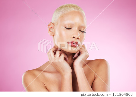 Woman, hands and face in beauty makeup, skincare cosmetics or facial treatment against a pink studio background. Female touching soft, smooth or gentle skin in satisfaction for self love or care Woman, hands and face in beauty makeup, skincare cosmetics or facial treatment against a pink studio background. Female touching soft, smooth or gentle skin in satisfaction for self love or care 131804803