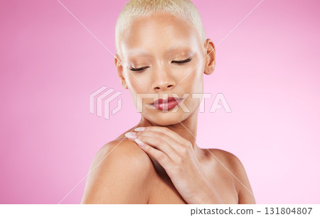 Face, beauty skincare and black woman in studio isolated on a pink background. Makeup, cosmetics and young female model or girl with glowing, healthy and flawless skin after spa facial treatment. 131804807