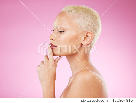Woman, beauty and makeup thinking about skincare cosmetics for facial or spa treatment against pink studio background. Female face and hands contemplating luxury cosmetic or perfect skin on mockup Woman, beauty and makeup thinking about skincare cosmetics for facial or spa treatment against pink studio background. Female face and hands contemplating luxury cosmetic or perfect skin on mockup 131804810