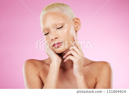 Woman, face and hands in beauty skincare cosmetics, makeup or facial treatment against a pink studio background. Female hand touching soft, smooth or gentle skin in satisfaction for self love or care 131804924