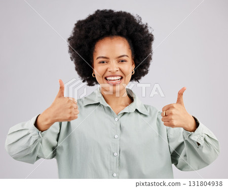 Portrait, thumbs up and black woman laughing in studio isolated on a white background. Success, happiness and person with hand gesture or emoji for winning, approval or agreement, like or thank you. Portrait, thumbs up and black woman laughing in studio isolated on a white background. Success, happiness and person with hand gesture or emoji for winning, approval or agreement, like or thank you. 131804938