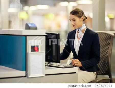 Airport, check in desk and woman on computer for security, travel agent or transport management. Airplane concierge, customer service and ticket help of global booking, journey or flight receptionist 131804944