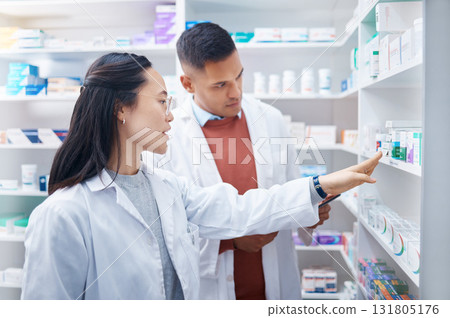 Pharmacist, coworkers and conversation with pills, medicine and inventory for stock with discussion. Pharmacy, man or Asian woman with healthcare, prescriptions or coaching for new process or system Pharmacist, coworkers and conversation with pills, medicine and inventory for stock with discussion. Pharmacy, man or Asian woman with healthcare, prescriptions or coaching for new process or system 131805176