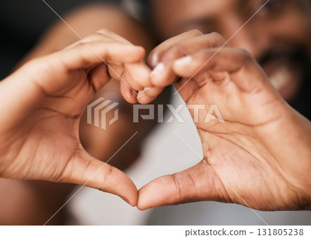 Love, hands in heart and happy black couple for relationship, dating and commitment in home. Valentines day, emoji sign and black woman and man smile with hand shape for bonding, romance and trust 131805238