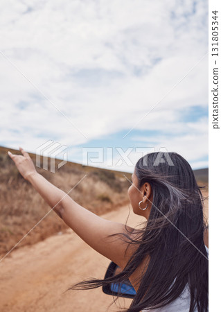 Travel, road trip and woman with hand out car, having fun and enjoying time outdoors. Adventure, freedom and girl or female on a drive in nature, desert or safari on holiday, vacation or journey. 131805344