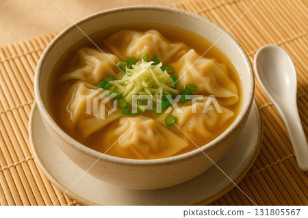 Steaming hot bowl of classic asian wonton soup with dumplings, fresh green onions and bamboo mat background in warm lighting, AI Generative Steaming hot bowl of classic asian wonton soup with dumplings, fresh green onions and bamboo mat background in warm lighting, AI Generative 131805567