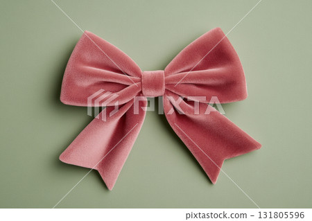 Soft pink velvet bow with long tails displayed on a pastel green background, showcasing elegant texture and gentle color contrast, AI Generative Soft pink velvet bow with long tails displayed on a pastel green background, showcasing elegant texture and gentle color contrast, AI Generative 131805596