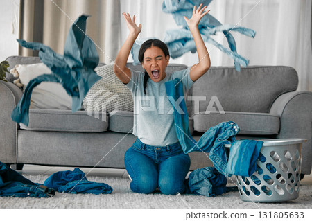 Laundry, angry and woman with clothes in air frustrated from cleaning, housekeeping and housework. Burnout, washing basket and upset, stressed and shouting female maid in living room throw clothing 131805633