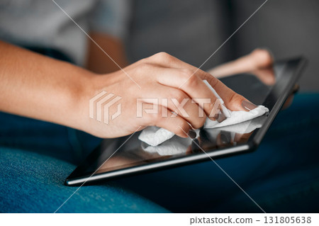 Woman hands, tablet and cleaning screen for dust, dirt risk and bacteria safety in home. Female, girl and device disinfection with microfiber cloth, surface care and hygiene of technology for health Woman hands, tablet and cleaning screen for dust, dirt risk and bacteria safety in home. Female, girl and device disinfection with microfiber cloth, surface care and hygiene of technology for health 131805638