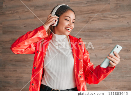 Headphones, phone and happy woman with music isolated on wood background, audio streaming and mobile app. Gen z student or biracial person with cellphone, electronics sound or online audio technology Headphones, phone and happy woman with music isolated on wood background, audio streaming and mobile app. Gen z student or biracial person with cellphone, electronics sound or online audio technology 131805643
