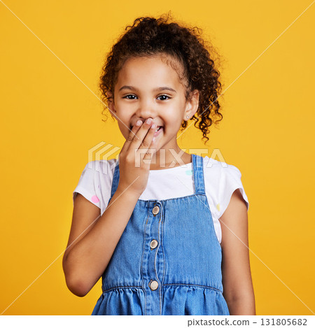 Laughing, happy and portrait of a child in a studio with a comic funny joke and positive mindset. Happiness, smile and face of a girl kid model giggling for comedy while isolated by yellow background Laughing, happy and portrait of a child in a studio with a comic funny joke and positive mindset. Happiness, smile and face of a girl kid model giggling for comedy while isolated by yellow background 131805682