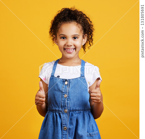 Thumbs up, girl and happy portrait isolated with a orange background in studio and yes gesture. Youth, happiness and agreement kid hand sign with a smile showing positive, thank you and motivation Thumbs up, girl and happy portrait isolated with a orange background in studio and yes gesture. Youth, happiness and agreement kid hand sign with a smile showing positive, thank you and motivation 131805691