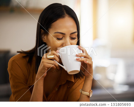 Happy, coffee and woman at home in a kitchen with a hot drink feeling relax and calm in the morning. Happiness, zen and young female drinking in a house holding a mug in a household with mockup 131805693