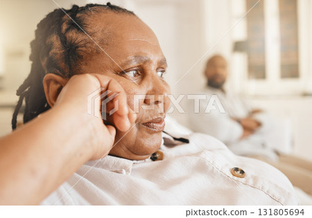Stress, divorce and elderly couple argue in their living room, frustrated and annoyed in their home. Marriage, crisis and senior woman with man in a lounge, fighting and moody after quarrel or issue 131805694